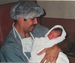 Dad and baby after cesarean in Calgary